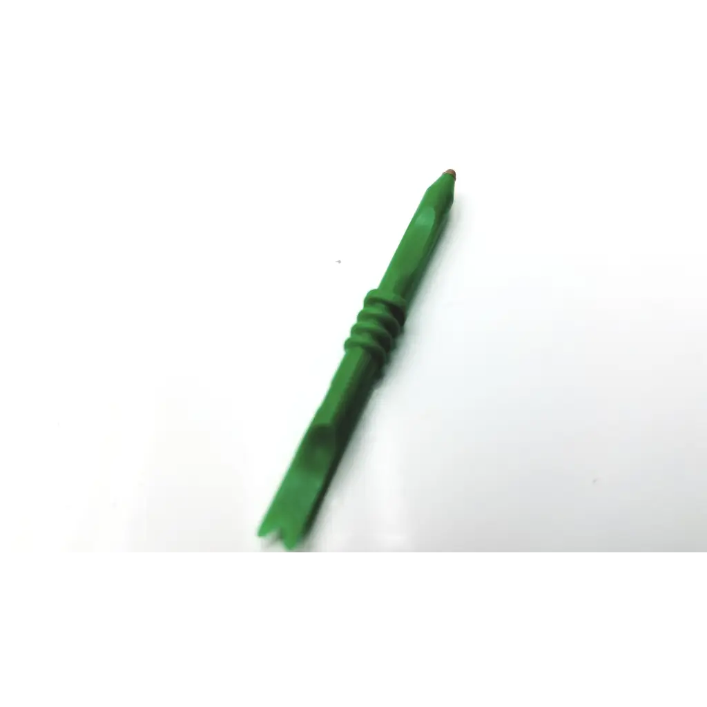 Green plastic tool with textured grip and pointed tip for 32 count starkey custom hearing aid medium brown microphone covers small