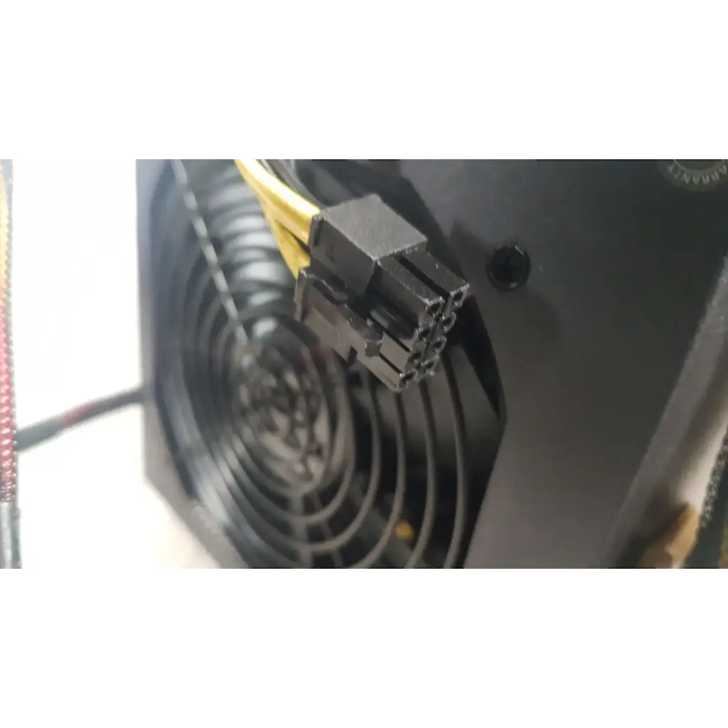 Black plastic 8-pin power connector with yellow cables on the back of the antec truepower 550w black switching power supply