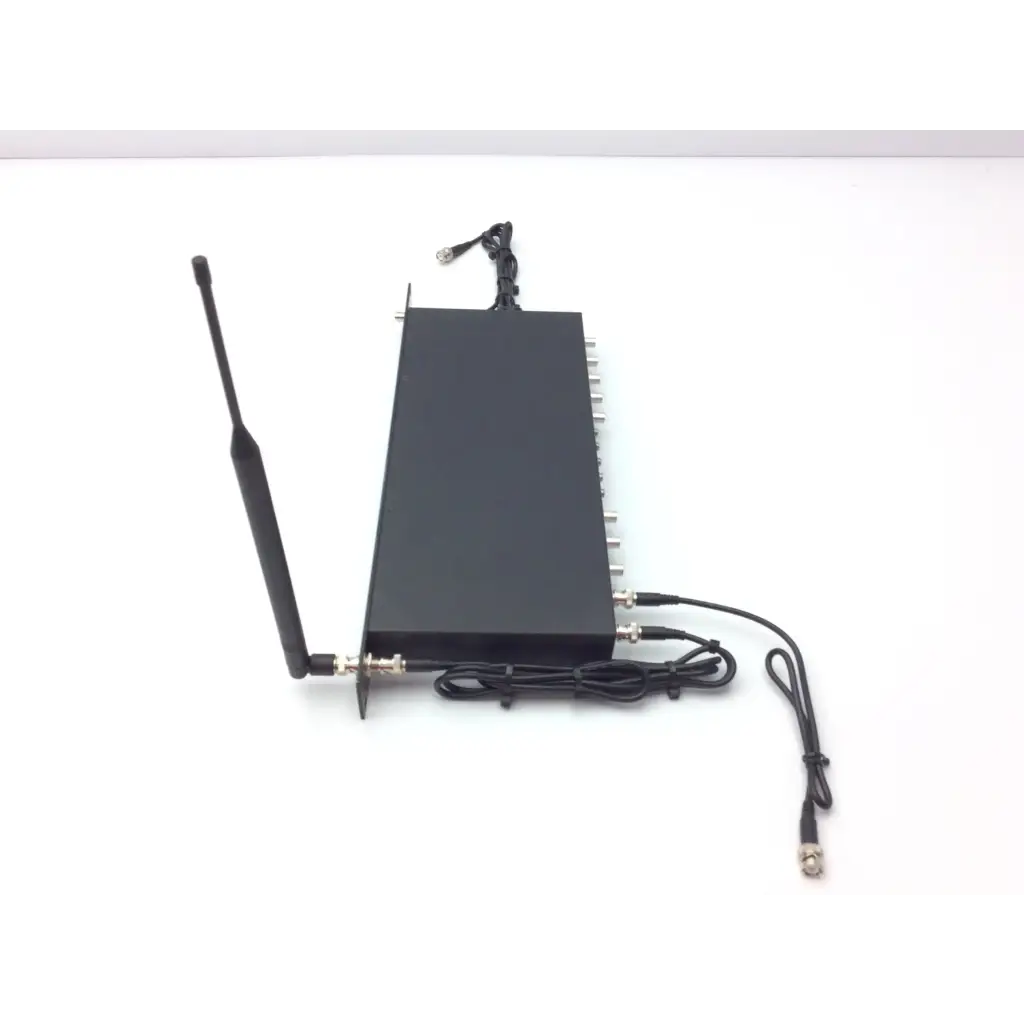 Black rectangular crestron cp2e professional media control processor showing back side with external antenna and coax ports