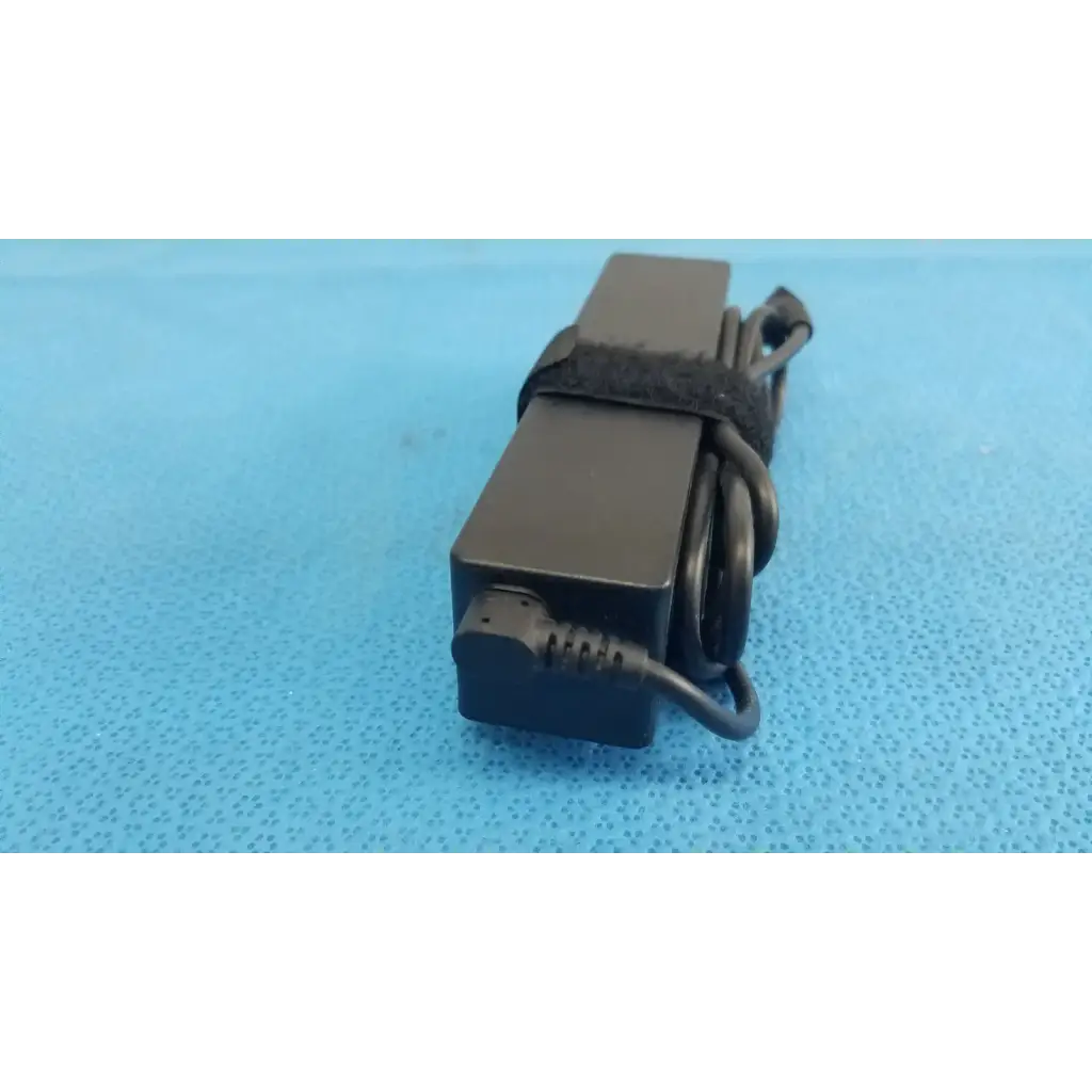 Black rectangular fujitsu ac adapter power supply 19v 3.16a with coiled cord and black strap for laptop use