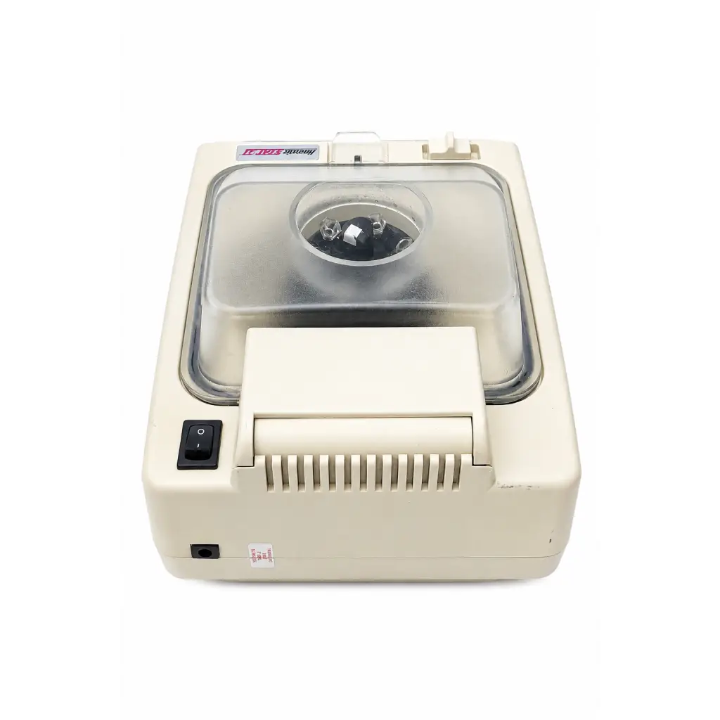 Cream-colored desktop microtome with transparent lid and black control panel in biomed certified hematastat-ii centrifuge medical equipment