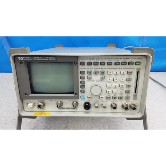 Gray hewlett packard 8920a communications test set with small screen and numerous control buttons for rf communications test