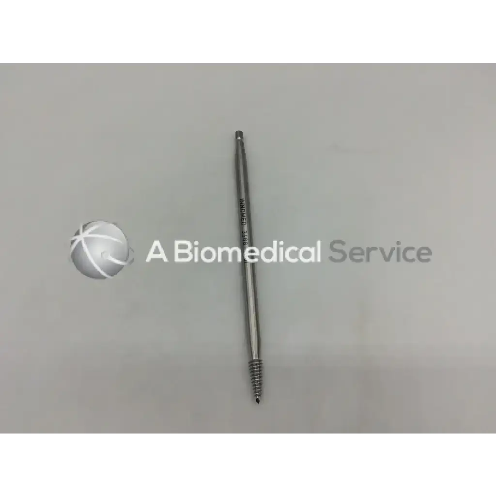 A metallic silver innomed 3688 femoral head remover quick connect screw with a threaded shaft engraved 3892 - 5601