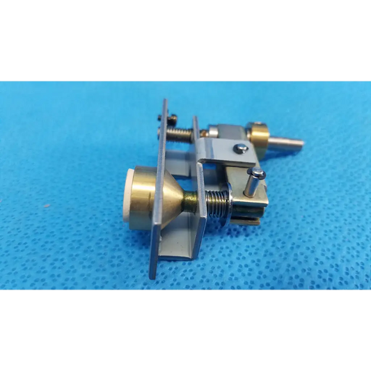 Brass and silver-toned metal mechanical assembly with threaded rods and plunger pin for topcon main unit locking knob