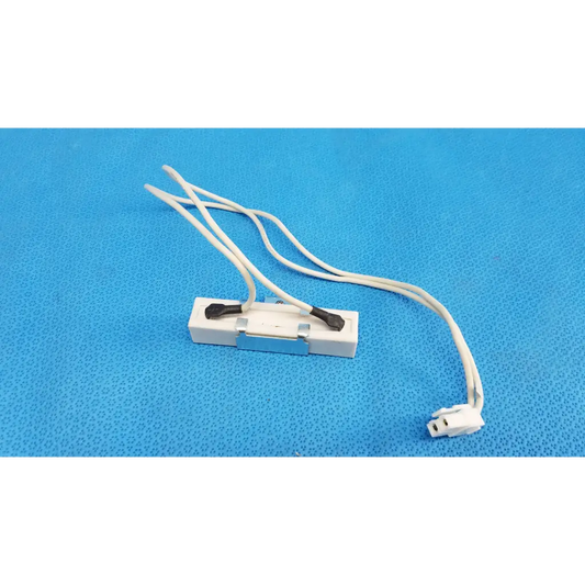 White plastic light fixture connector with black terminal caps and bundled wires for ceramic power resistor fundus retinal camera