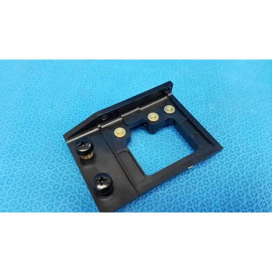 Black plastic sim card tray with gold screws and card cutout for internal optical alignment mirror mount slider bracket