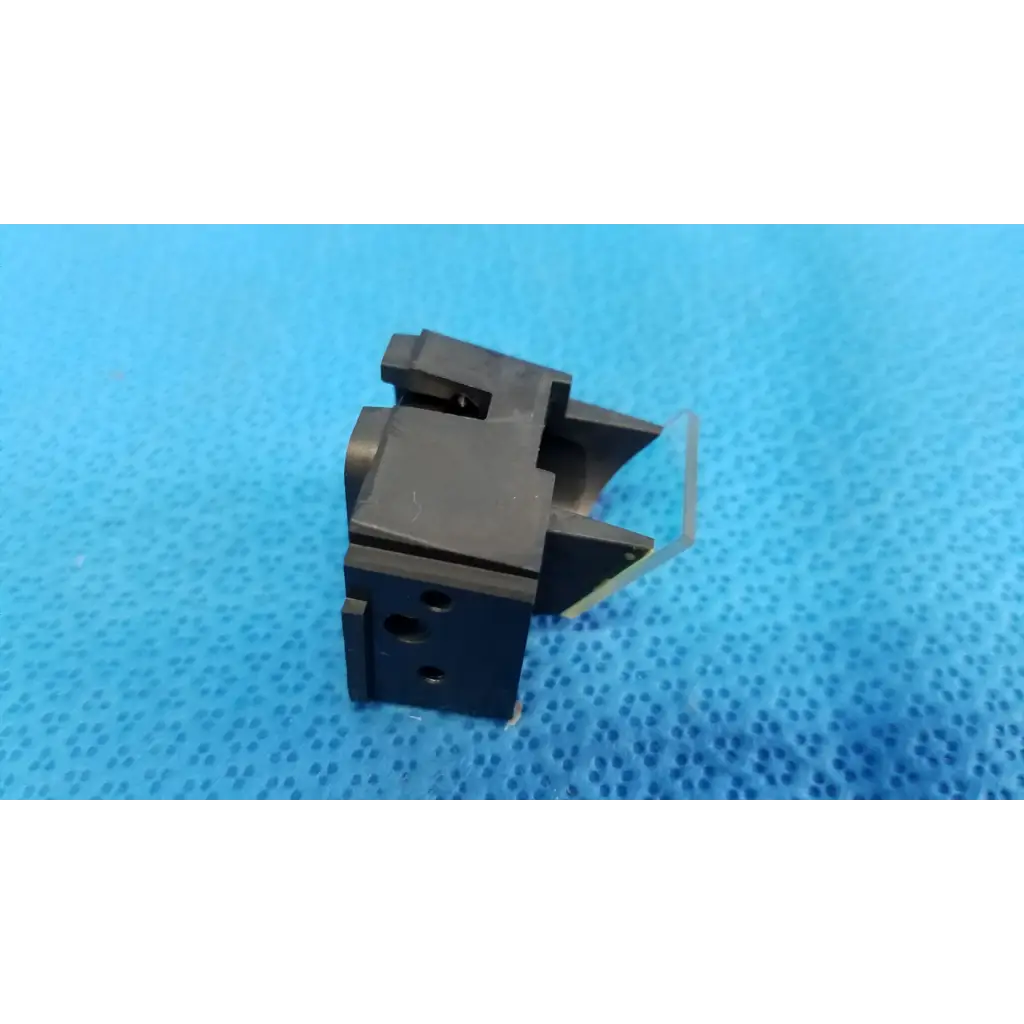 Black plastic internal optical beam splitter half mirror lens block with angular design and circular cutouts for topcon fundus camera