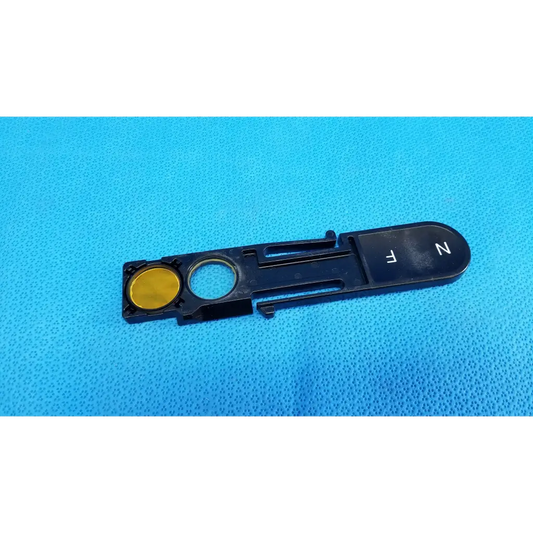 Black plastic optical filter slider key with gold button and white fn lettering for topcon fundus retinal camera