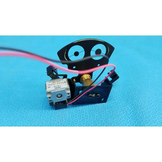 Black robot-shaped internal takano rotary solenoid aperture diaphragm with silver motor and pink wire for topcon camera