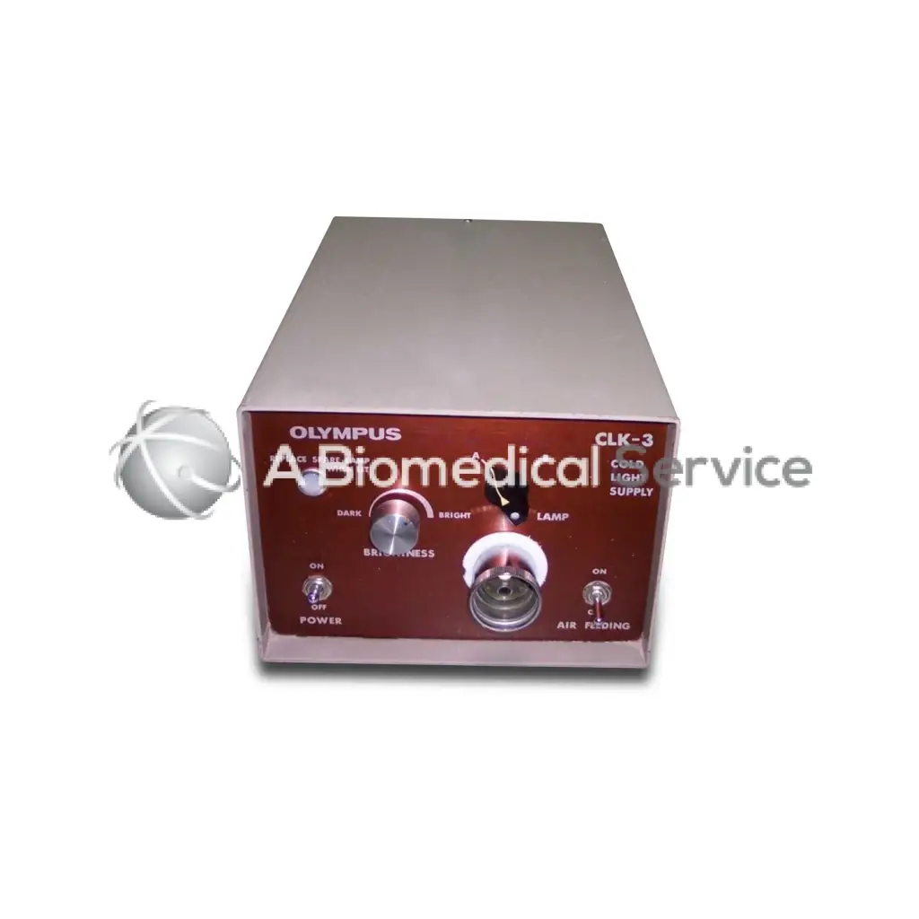 Olympus clk-3 cold light supply with maroon front panel, silver metallic casing, and brightness and lamp control knobs