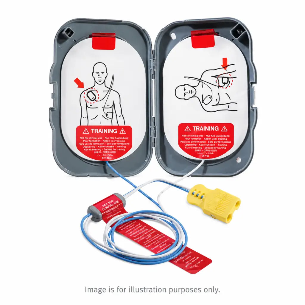 Gray plastic case with white philips heartstart adult training pads featuring red labels and blue wires connected to yellow connector