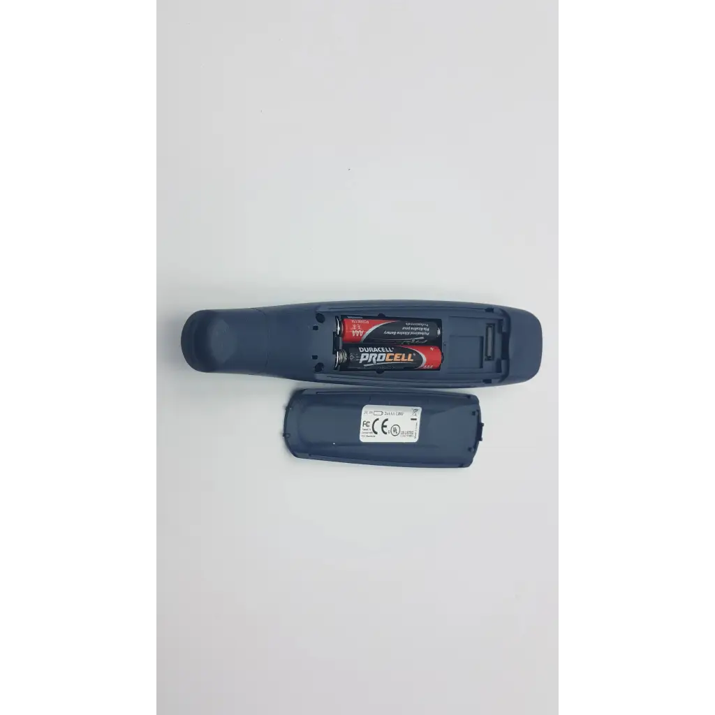 Back side of dark blue plastic readingpen advanced edition remote control with duracell procell batteries and regulatory labels