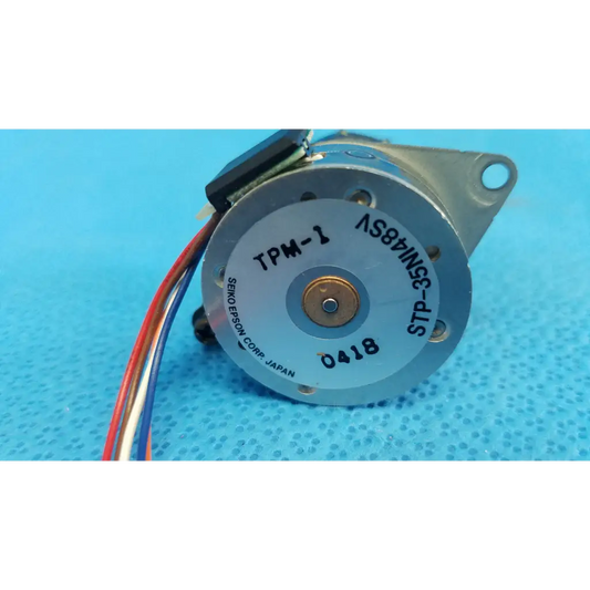 Silver-colored internal shutter stepper motor with black wiring and model tpm-1 label for topcon retinal camera