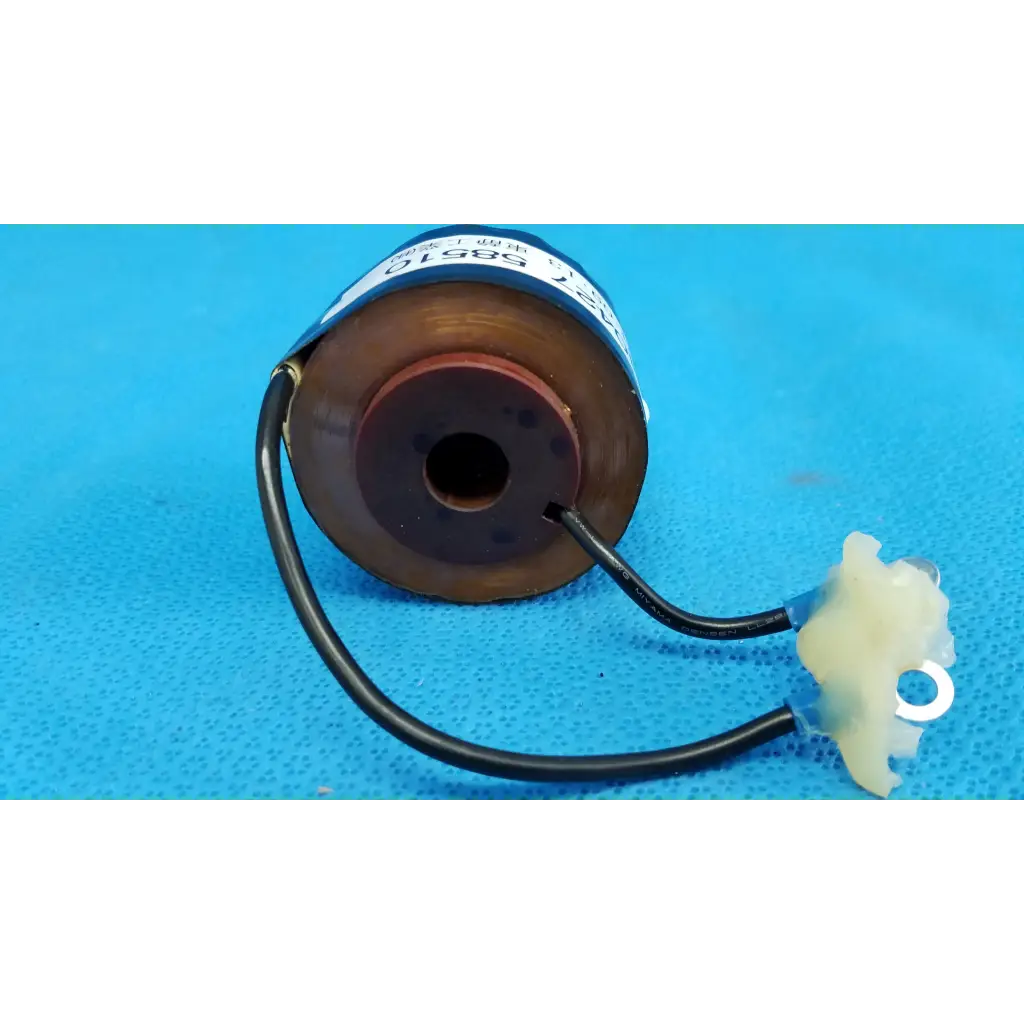 Brown cylindrical solenoid actuator electromagnetic coil with black wiring and white connector for topcon retinal camera