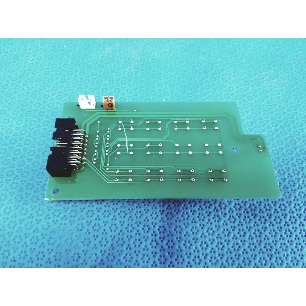 Green rectangular control switch pcb board with silver soldered connections and black connector pins for topcon trc-nw300