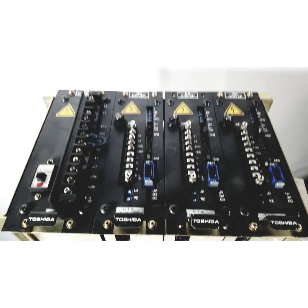 Black Toshiba RA power RAD92-1008 industrial control panels with silver connectors and blue terminal blocks for power supply