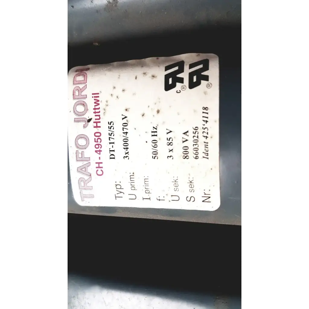A white label with black and red text showing trafo jordi ch-4950 technical specifications on huttwil transformer dt-175/55