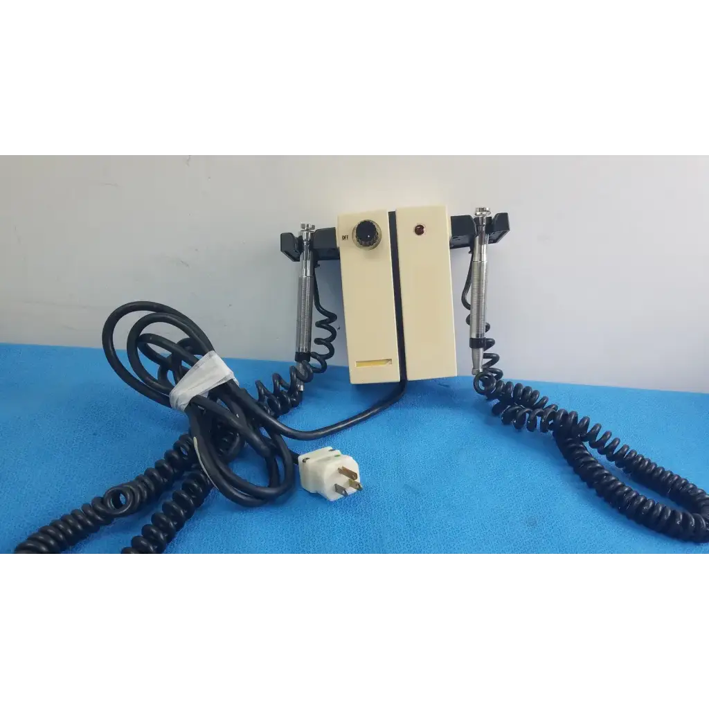 Cream-colored wall mounted transformer otoscope and ophthalmoscope by welch allyn with black accents and coiled cables