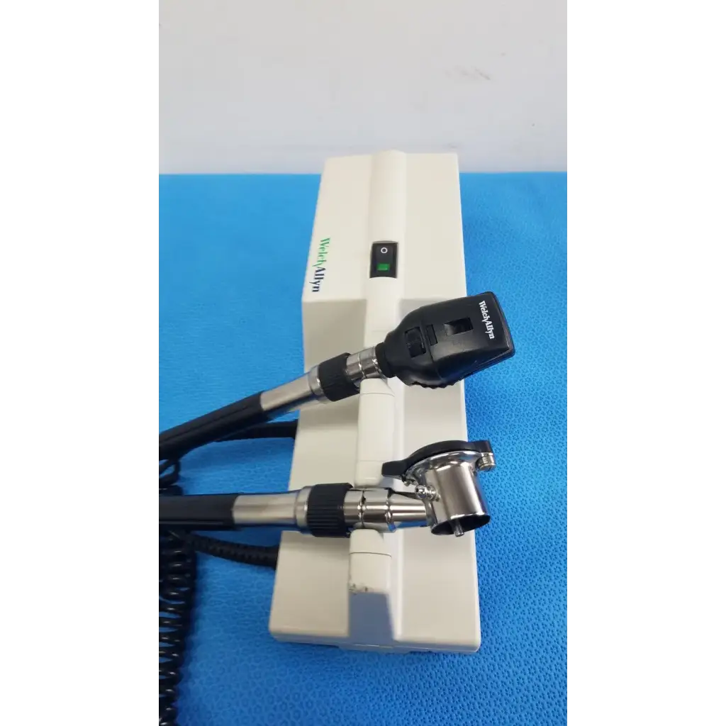 Welch Allyn 767 wall transformer with white and black coaxial ophthalmoscope featuring a sleek ergonomic design