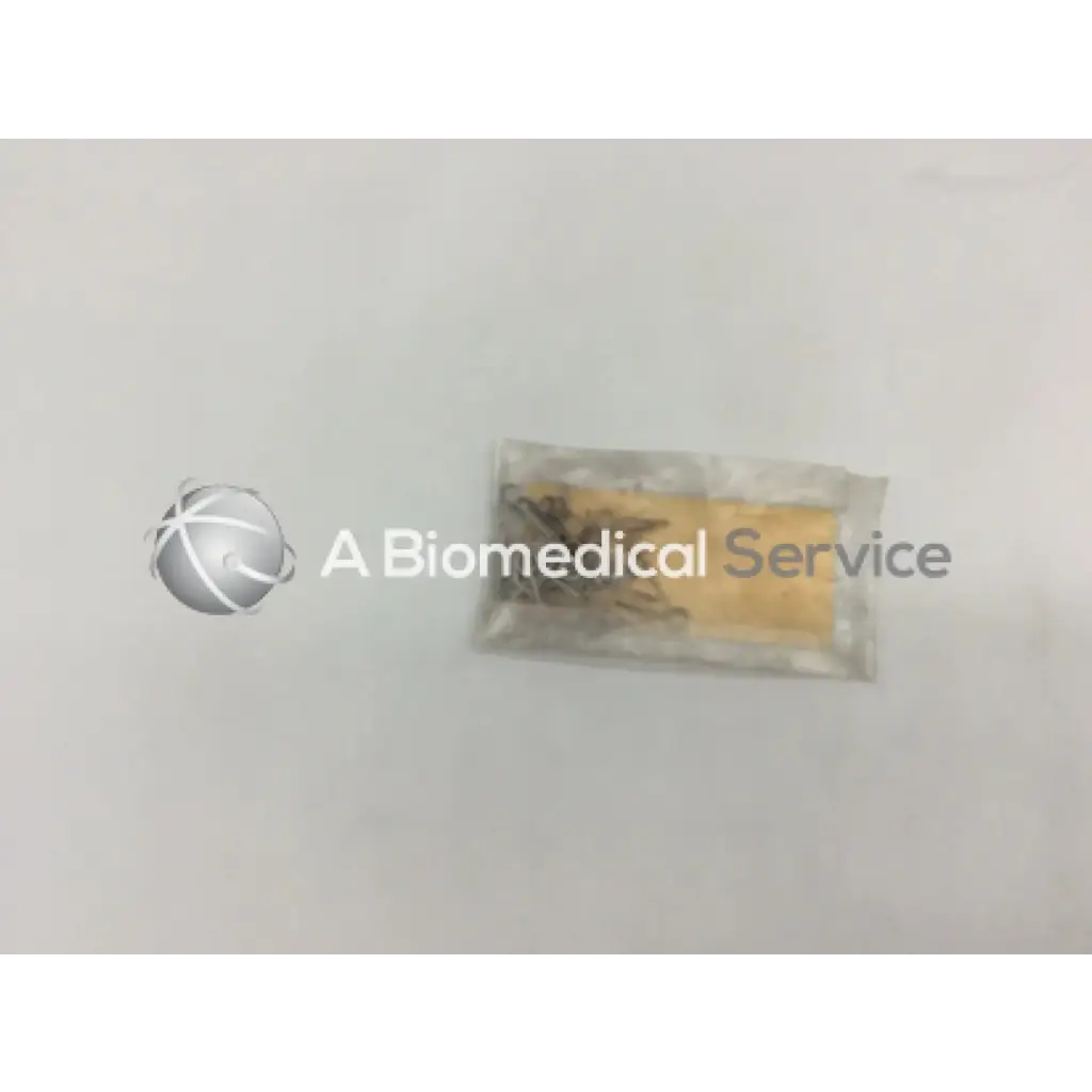 A clear plastic bag containing howmedica orthopedic fixation stop clip 5mm metal surgical clips with yellow insert