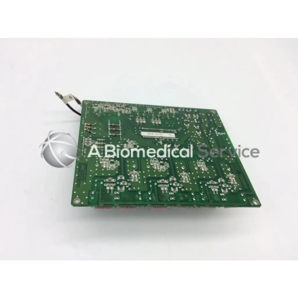 Green rectangular jrc ta-0038 pc-0662b board with silver soldered components and small white spherical object attached