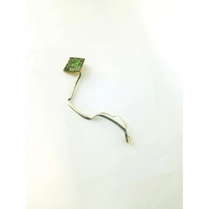 Green control board tf-12 with black flexible ribbon cable attached for electronic device connections and control functions