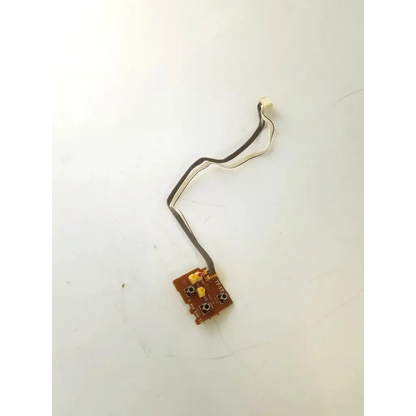 Brown rectangular control board tf-12 with black and white ribbon cable for electronic device connections