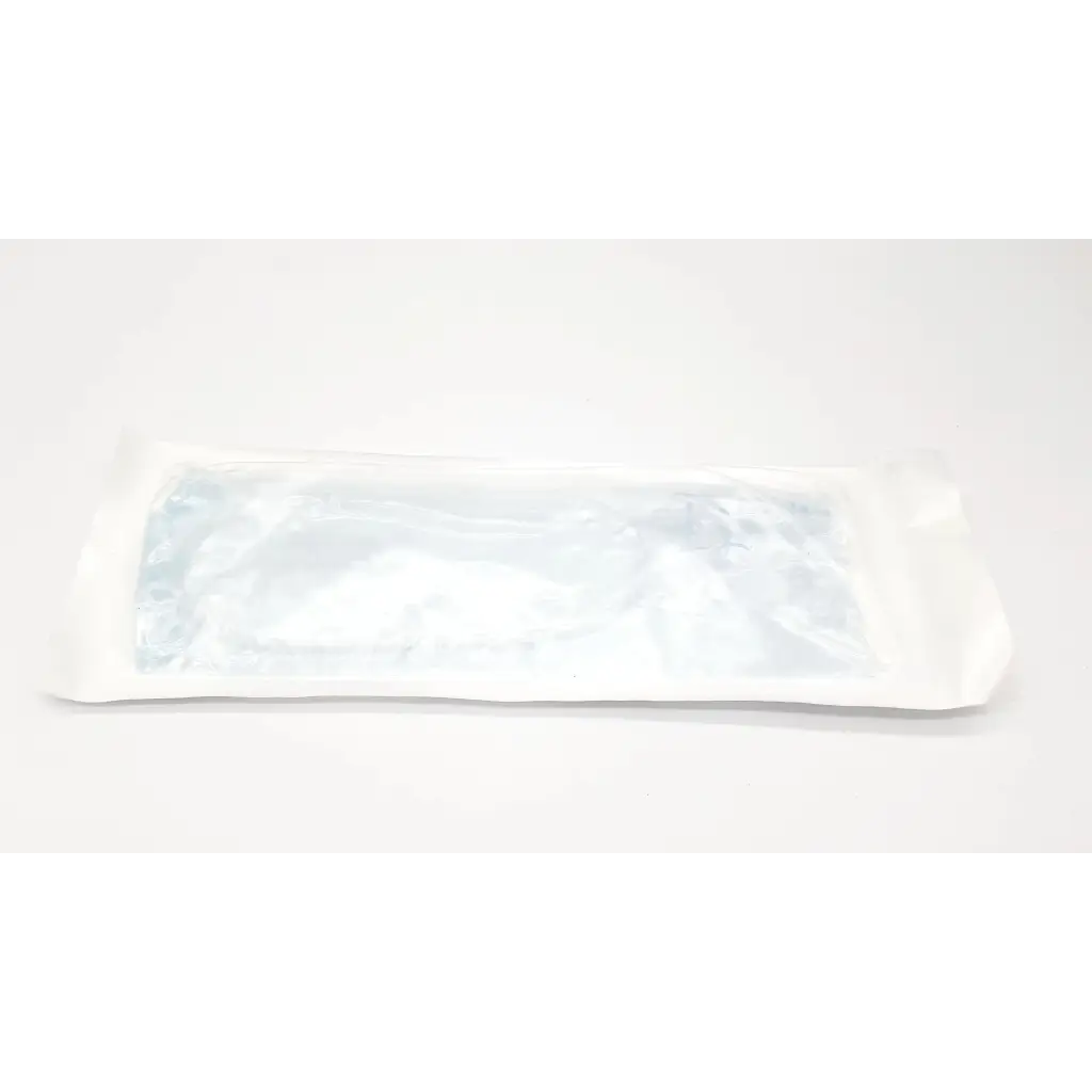 A sterile transparent plastic-wrapped 10 fr suction cath n glove in a white paper sleeve for medical use
