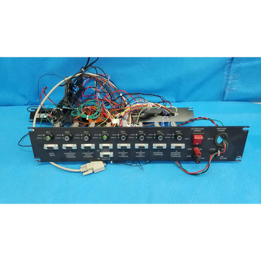 Black 19-inch rackmount control panel interface chassis with multiple ports and colorful cable wire harness on back side