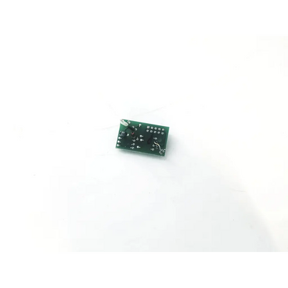 Green rectangular 20067c circuit board with various mounted electronic components for electronic applications