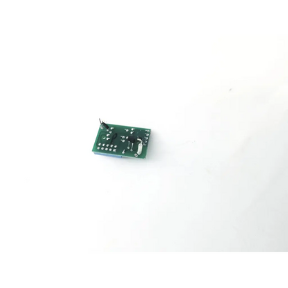 Green rectangular 20067c circuit board with black and silver electronic components for electronic devices