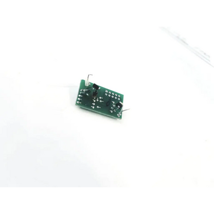 Green rectangular 20067c circuit board with black electronic components and silver solder points for electronics use