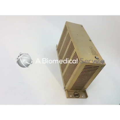 Tan metallic rectangular 302350P3 ge amx-4 lvle condor power supply with vertical slotted ventilation for biomedical service