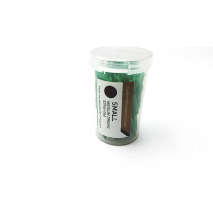 A clear plastic container of 32 count starkey custom hearing aid medium brown small microphone covers with a label
