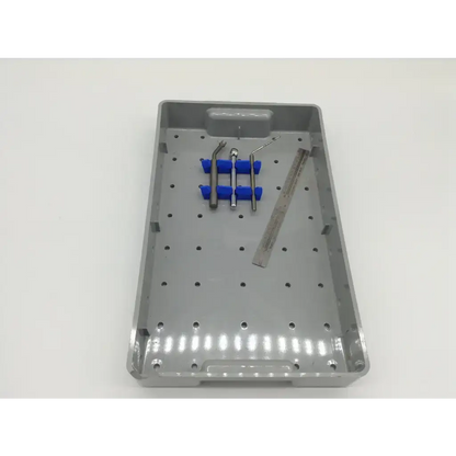 Gray plastic 3i Biomet dental implant surgery instrument kit with blue rubber holders and metallic tools for tapered implant depth