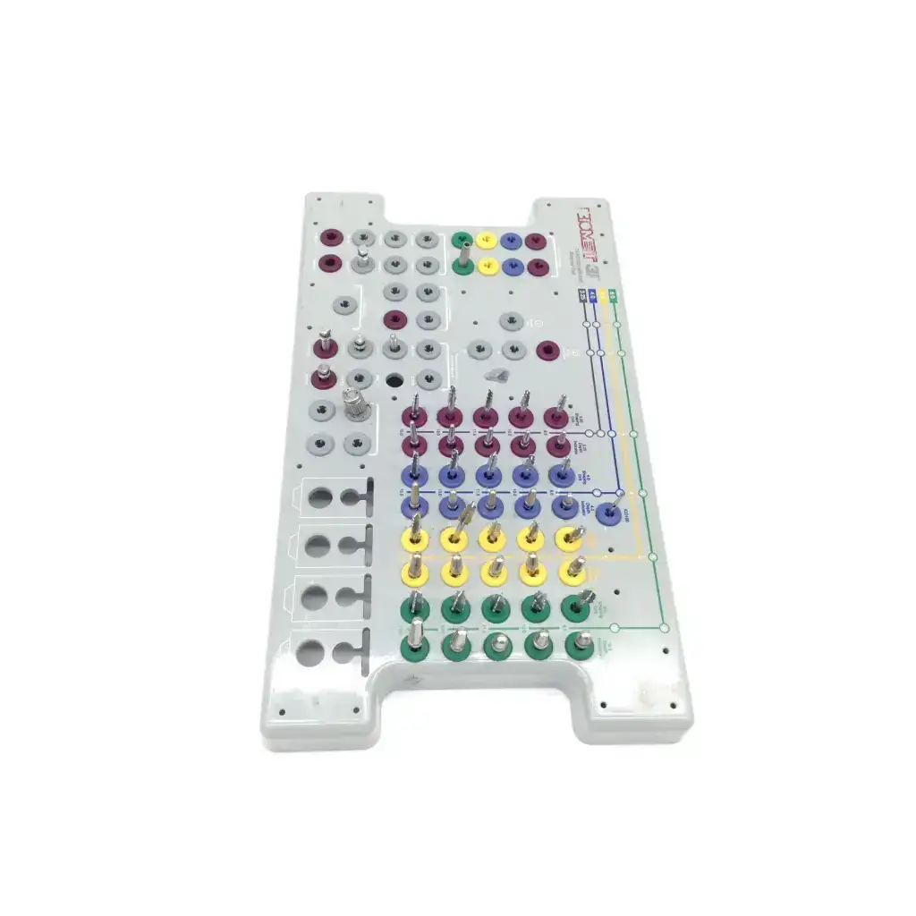 White plastic 3i Biomet dental implant surgery guide with colorful circular pegs for tapered implant depth control