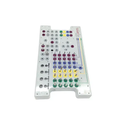 White plastic 3i Biomet dental implant surgery guide with colorful circular pegs for tapered implant depth control