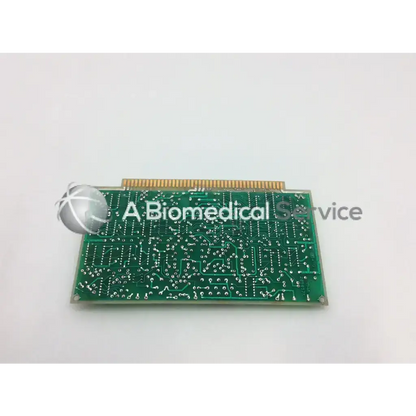 Green rectangular g1-k board bbcf1-1 with gold connector pins and white printed circuit traces for electronic use