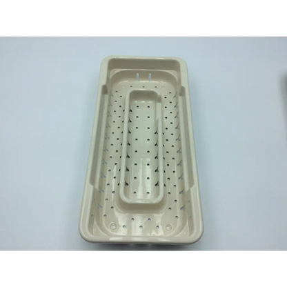 Beige plastic surgical instruments drill set tray with perforated surface and recessed compartment for microaire use