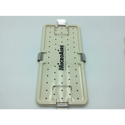 Beige plastic microaire surgical instruments drill set tray with black perforations and silver metal clasps