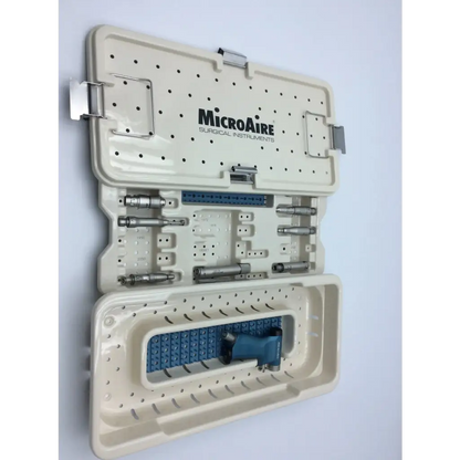Beige plastic case with silver latches labeled microaire surgical instruments holding a surgical instruments drill set