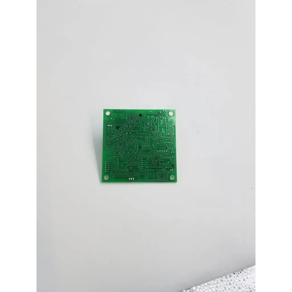 Green rectangular rev c control board bbca2-12 with intricate copper traces and four mounting holes for electronic control