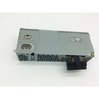 Backside of gray metal genuine apple imac 20 inch 180w power supply api3pc96 with honeycomb ventilation and cables