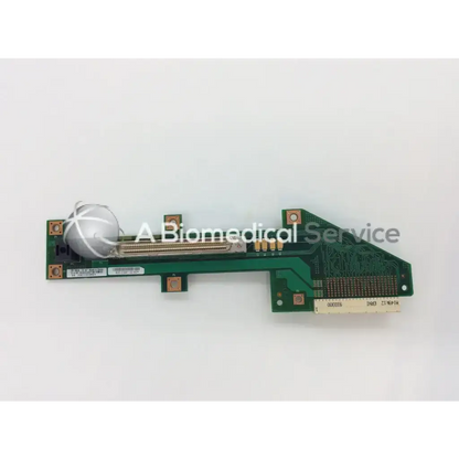 Green circuit board of cisco slot backplane with silver spherical component and gold-colored connectors