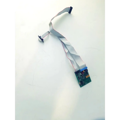 Gray flexible ribbon cable with black connectors attached to a green circuit board bbcb3-8c 99400903 board 22523sm