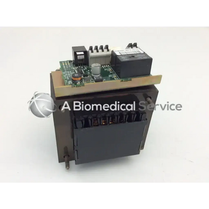 Black rectangular dental light relay module with green circuit board for biomedical service a-dec 43.0043.00
