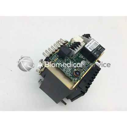 Black and green electronic dental light relay module with printed circuit board and connectors for biomedical service