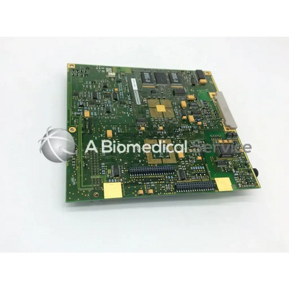 Green printed circuit board with gold and black components featuring central processor chip on a3951-16990 board