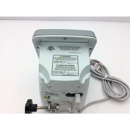 Gray aaron bovie 950 electrosurgical unit generator with coiled power cord and black adjustment knob visible from back side