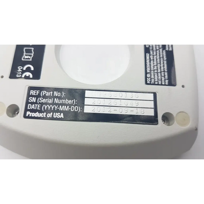 Back side of white plastic abbot medical optics whitestar signature phaco unit remote with black serial label